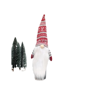 Knitted Christmas gnome bottle topper with red geometric hat and long white beard decor