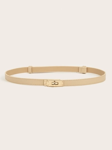 Detail of adjustable beige waist belt with golden twist lock buckle for dresses