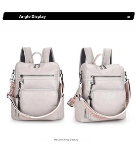 Detail view of macaron grey vintage backpack with woven strap and tassel charm