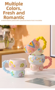 Detail of creative ceramic mugs with colorful beaded handles and hand-painted relief patterns