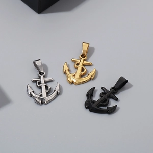 Detailed close-up of anchor pendants in silver, gold and black stainless steel finishes