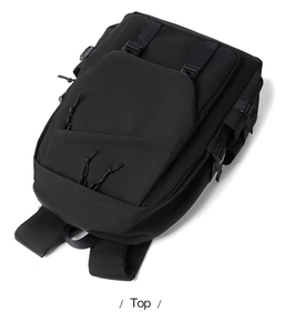 Top view of large black tactical backpack with multiple compartments and buckled straps