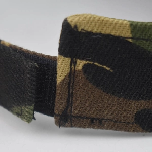 Polyester camouflage sun visor hat with adjustable velcro closure and reinforced stitching
