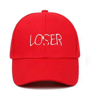 Macro detail of LOSER letter embroidery with red V overlay on cotton twill baseball cap