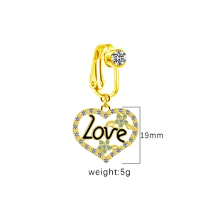 Detail of 19mm gold heart-shaped non-piercing belly ring with Love engraving and white crystals
