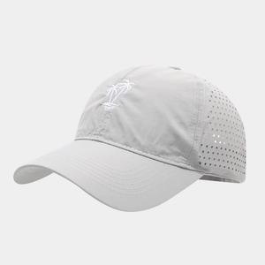 Detail of laser-cut ventilation holes and palm tree embroidery on quick-dry baseball cap
