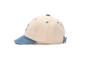 Side view of baby baseball cap with light blue brim and adjustable strap closure