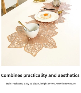 Macro detail of rose gold PVC table runner with elegant hollow leaf floral patterns