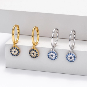Detailed macro view of S925 sterling silver hoop earrings with Evil Eye zircon charm