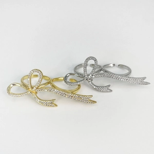Sparkling pavé crystal bow open rings set in gold and silver finish for women