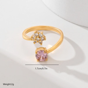 Detailed view of leaf ring with pink gemstone and small flower, size 1.7cm and weight 2g