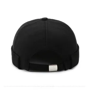 Detail of the adjustable black brimless cap back with a silver metal buckle