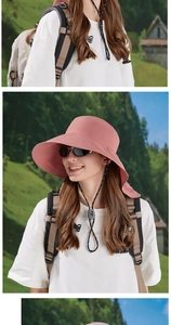 Pink wide brim sun hat detail showing quick-dry fabric and adjustable chin strap