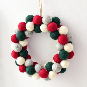 Handmade wool felt ball Christmas wreath in red green and white for wall hanging decor