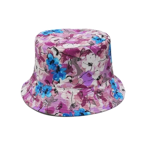 Detailed view of colorful floral pattern on a double-sided reversible cotton bucket hat