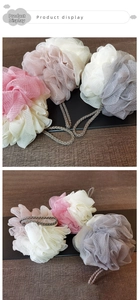 Detail of soft mesh bath sponges in dual-color pastel tones with braided hanging ropes