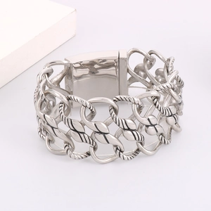 Macro detail of men's titanium steel bracelet with twist chain and polished clasp