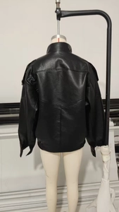 Back view of a black faux leather jacket with high collar and pebbled texture detail