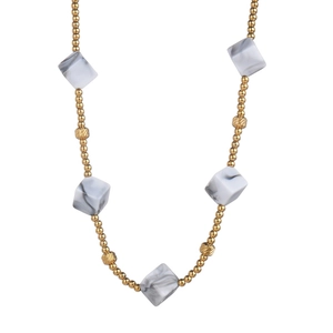 Bohemian gold necklace with geometric marble pendants and spiral beads on white background