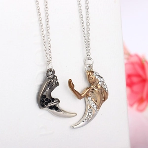 Couples jigsaw necklace set with abstract silhouette pendants in black and gold