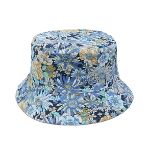 Detailed view of floral sunflower patterns on a casual summer sun bucket hat