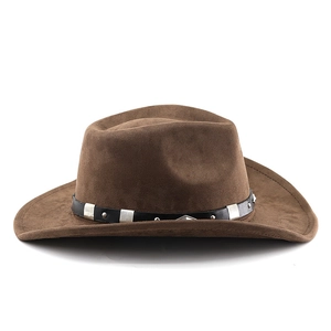 Detail of classic brown suede cowboy hat with black leather band and silver metal studs