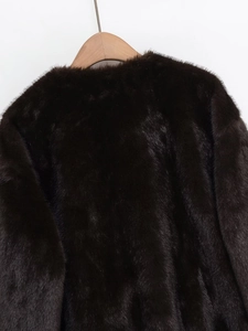 Close-up of the plush dark brown faux fur collar and back texture on a bomber jacket
