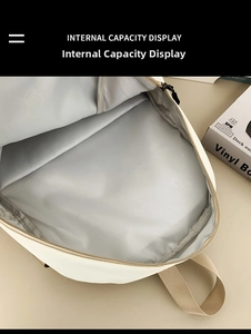 Internal capacity view of minimalist backpack showing spacious main compartment with printed liner