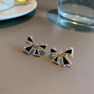 Exquisite S925 silver black bow stud earrings with gold plating and sparkling crystals