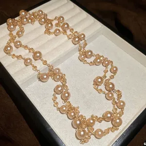 French style layered pearl and crystal bead necklace in a beige velvet jewelry box