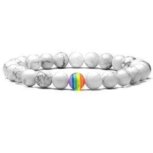 Close-up of white turquoise stone bracelet featuring a vibrant rainbow bead accent