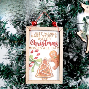 Christmas wooden plaque hanging on a snowy tree with gingerbread man and candy cane design