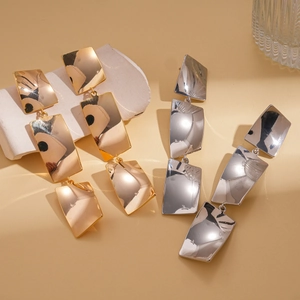 18k gold and silver plated geometric square layered drop earrings set on decorative props