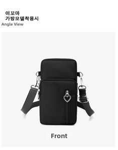 Front view of black nylon crossbody phone bag with multi-layer zippers and heart charm