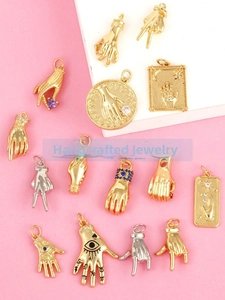 Detailed collection of micro-pave copper Hamsa hand charms with colorful zircon accents
