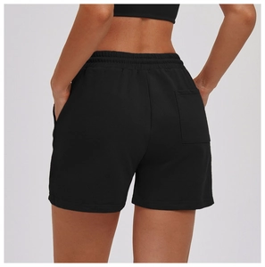 Rear view of black high-waisted athletic shorts featuring a practical back patch pocket