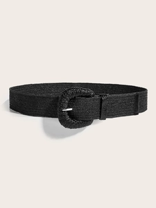 Vue détaillée d'une ceinture tressée noire avec une grande boucle ronde assortie