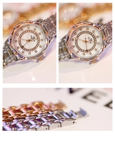 Detailed macro view of silver and rose gold metal watch band with rhinestone accents