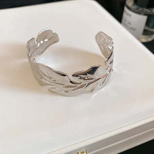 Detail of silver leaf cuff bracelet showing clear leaf texture and polished finish