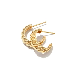 Polished gold croissant hoop earrings with minimalist twist texture on white background
