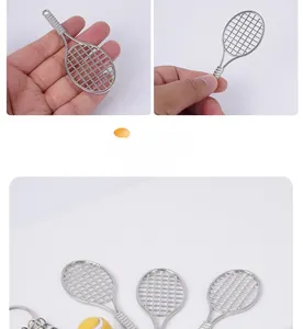 Detailed close-up of a mini silver metal tennis racket keychain with realistic grid texture