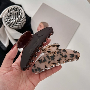 Handmade French acetate hair claws in dark brown and tortoiseshell pattern finish
