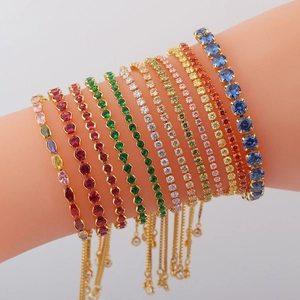 Detail of colorful cubic zirconia tennis bracelets with adjustable gold plated chains