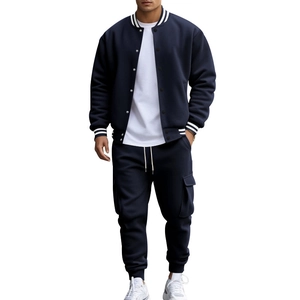 Close-up of navy baseball jacket with stripe collar and cargo pants with flap pockets