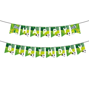 Close-up of Happy Birthday banner with soccer ball designs and green field patterns
