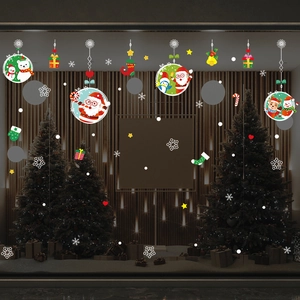 Christmas window stickers with Santa, snowman and reindeer on glass storefront display