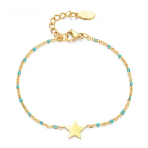 Detail of gold star pendant bracelet with blue turquoise beads and lobster clasp