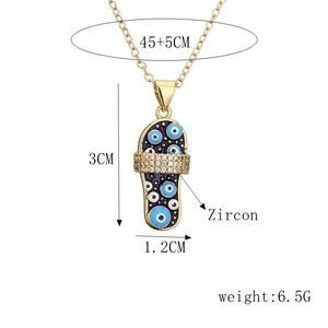 Detailed view of flip-flop pendant with zircon blue evil eye and dimension specs