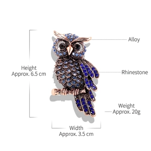 Luxurious blue crystal owl brooch in rose gold finish with sparkling rhinestones