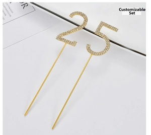 Close-up of number 25 cake topper with sparkling rhinestones on golden metal stems